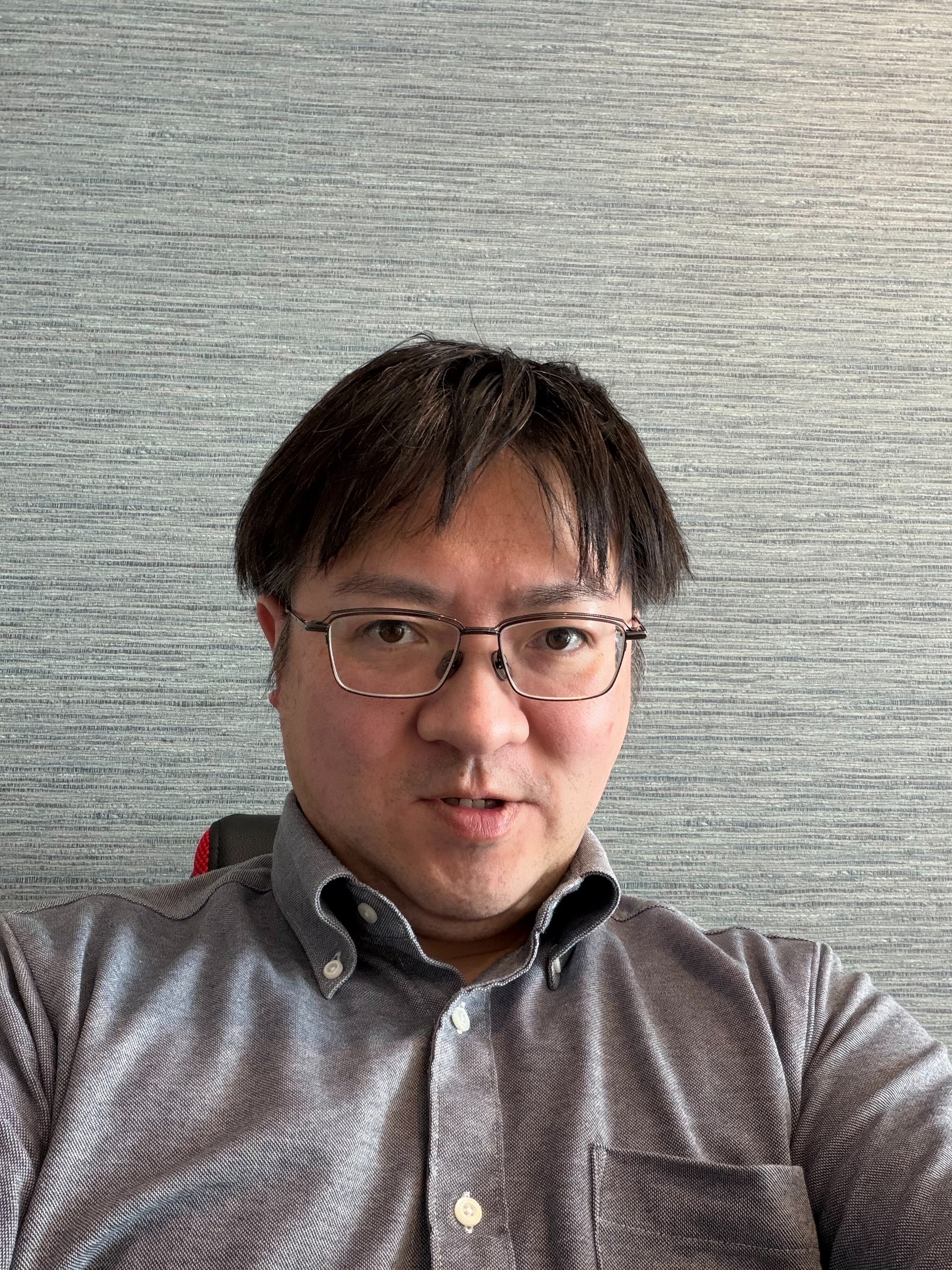 新保健一さん